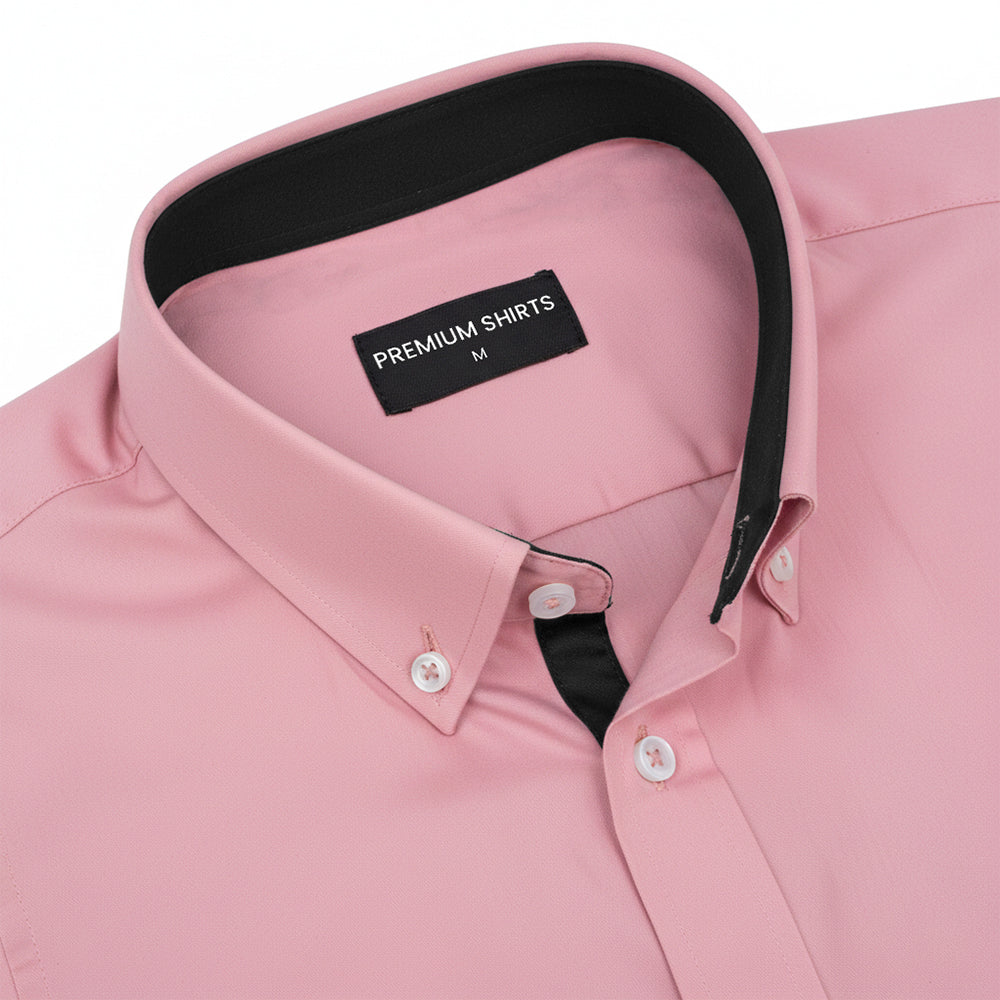 Pink dress shirt with black interior on a white background