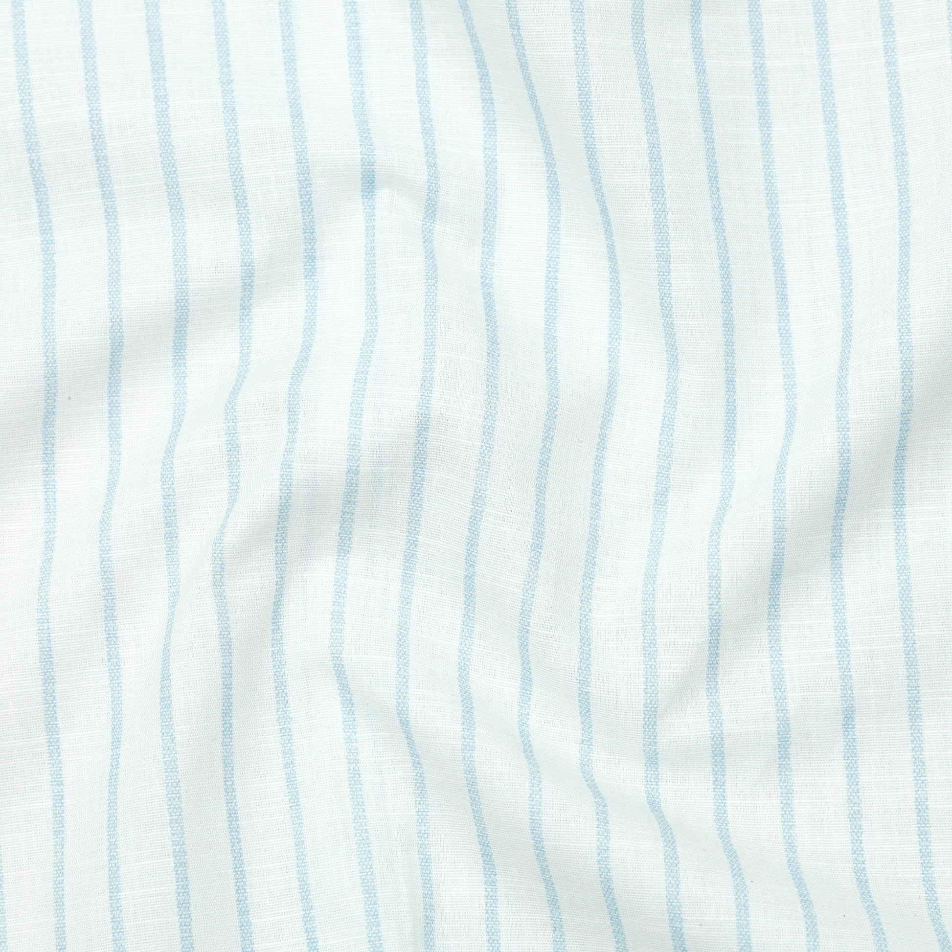 Close-up of fabric with light blue vertical stripes on a white background