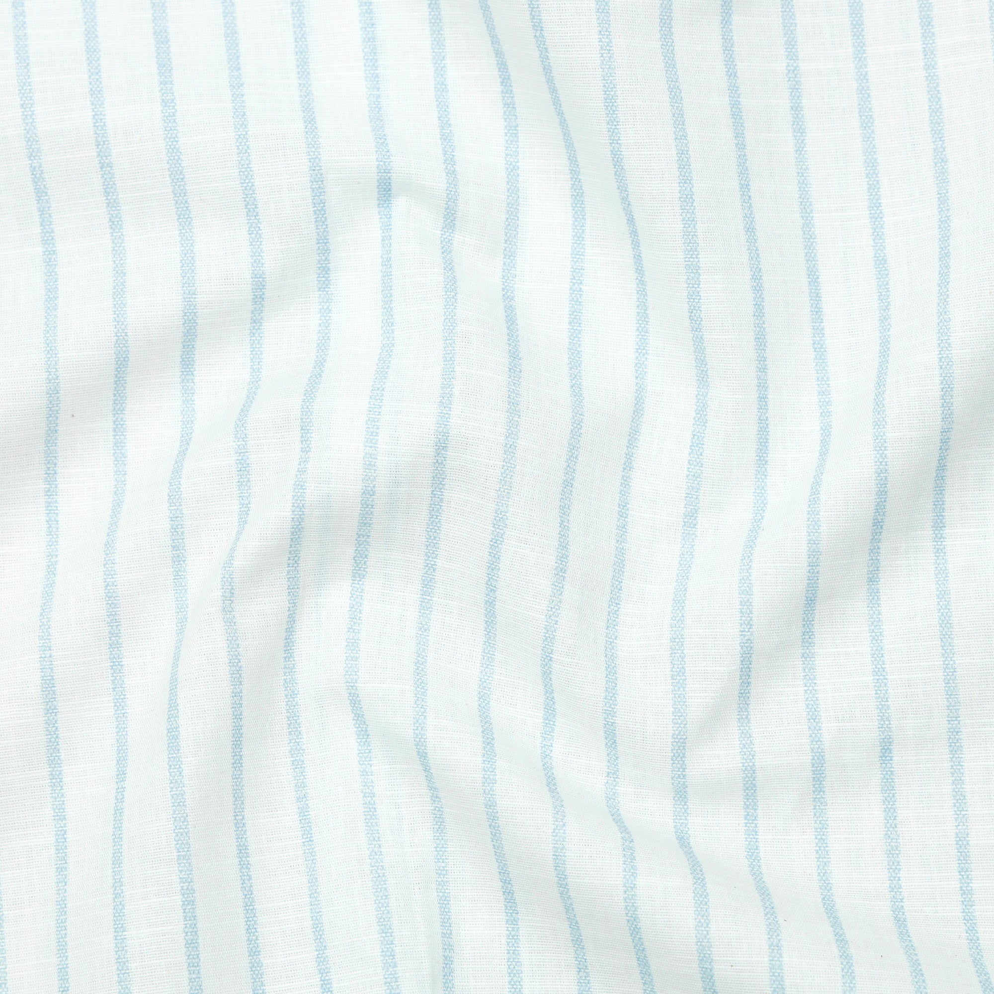 Close-up of fabric with light blue vertical stripes on a white background