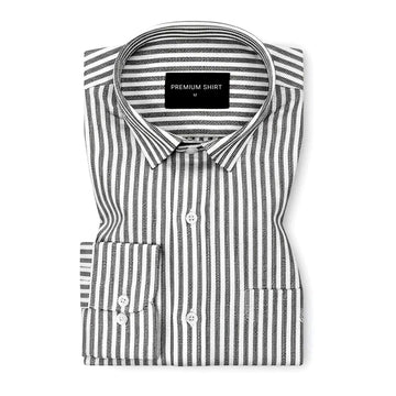 Folded black and white striped shirt with a visible brand label on a white background