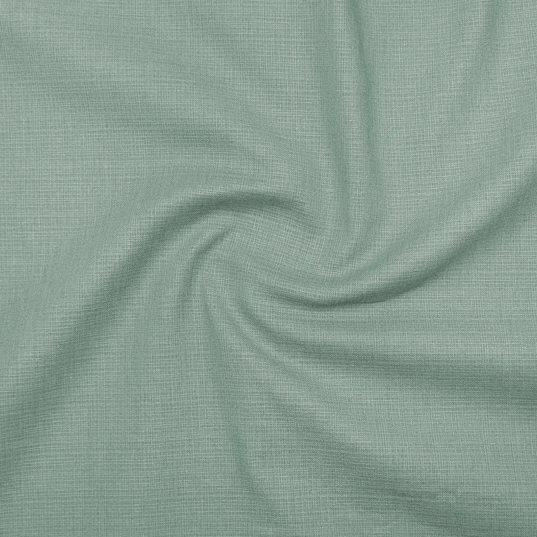 Green dress shirt with close-up of fabric texture on a white background